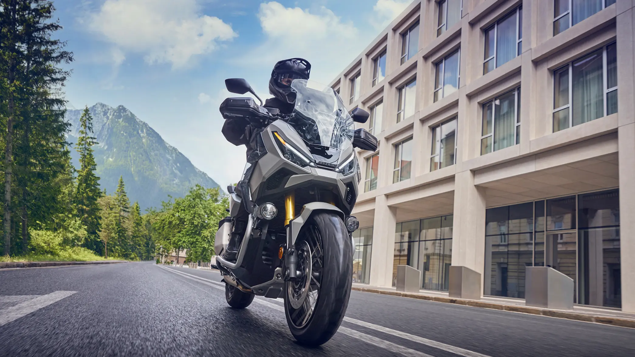 2025 X-ADV with mountain and building